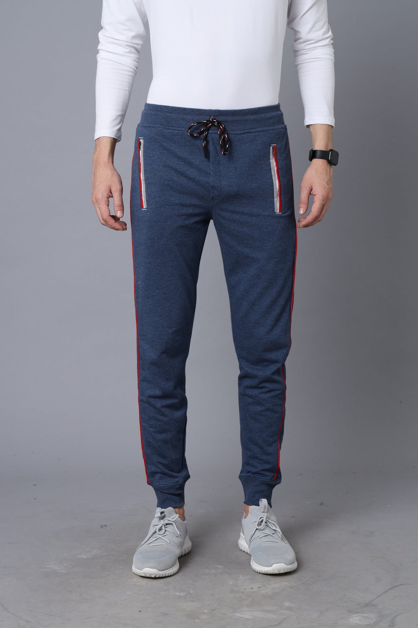 Blue track pants with zipper pockets