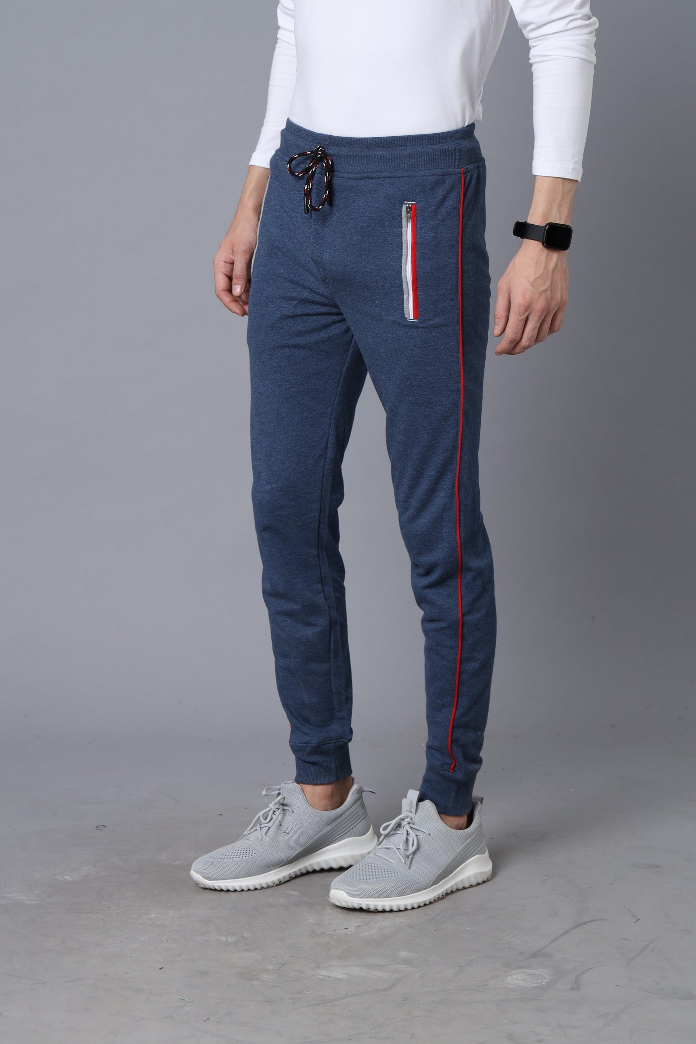 Blue track pants with zipper pockets